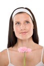 Beautiful woman holding gerbera daisy flower Royalty Free Stock Photo
