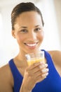 Beautiful Woman Holding Glass Of Orange Juice At Gym Royalty Free Stock Photo