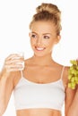 Beautiful woman holding grapes and water Royalty Free Stock Photo