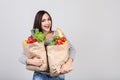 Woman holding grocery shopping bags Royalty Free Stock Photo