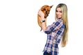 Beautiful woman holding her little puppy near a copyspace and lo Royalty Free Stock Photo