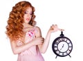 Beautiful woman holding a large clock.