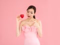 Beautiful woman holding mini heart,sexy girl show fingers Royalty Free Stock Photo