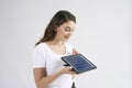 Beautiful woman holding a model of solar panel