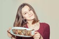 Woman holding plate with shrimps on white grey background Royalty Free Stock Photo