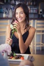 Beautiful woman holding rose flower and smiling Royalty Free Stock Photo