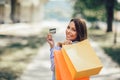 Beautiful woman holding shopping bags and a credit card Royalty Free Stock Photo