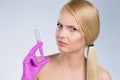 Beautiful woman holding syringe in hand in glove Royalty Free Stock Photo