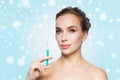 Beautiful woman holding syringe with injection Royalty Free Stock Photo