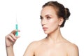 Beautiful woman holding syringe with injection Royalty Free Stock Photo