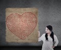 Beautiful woman holds heart maze map