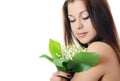 The beautiful woman holds lily of the valley Royalty Free Stock Photo