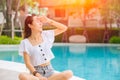 Beautiful woman with hot sunshine in summer sky for skin care and UV sun block Asian people beauty concept Royalty Free Stock Photo