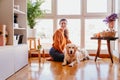 beautiful woman hugging her adorable golden retriever dog at home. love for animals concept. lifestyle indoors Royalty Free Stock Photo