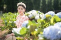 Beautiful woman in the flower garden