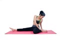 Beautiful woman indoor exercising using pink yoga mat