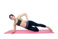 Beautiful woman indoor exercising using pink yoga mat Royalty Free Stock Photo