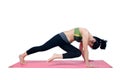Beautiful woman indoor exercising using pink yoga mat Royalty Free Stock Photo