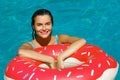 Beautiful woman and inflatable swim ring in shape of donut Royalty Free Stock Photo