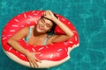 Beautiful woman and inflatable swim ring in shape of donut Royalty Free Stock Photo