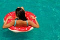 Beautiful woman and inflatable swim ring in shape of donut Royalty Free Stock Photo