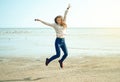 Beautiful woman jeans sweater jumping laughing