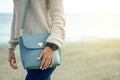 Beautiful woman in a jeans sweater shoes female bag watch Royalty Free Stock Photo