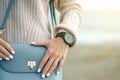 Beautiful woman in a jeans sweater shoes female bag watch Royalty Free Stock Photo