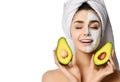 Beautiful woman with just applied avocado facial mask cream wonderful cosmetics effect and is inspired