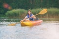 Woman and her dog on a kayak Royalty Free Stock Photo