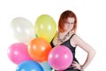 Beautiful woman keeping multicolored air balloons
