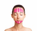 Beautiful woman with kinesiology facelift tapes.