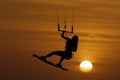 Santa Veronica, Colombia 2021. Beautiful woman kitesurfing jumping at sunset Royalty Free Stock Photo