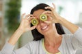 Beautiful woman with kiwi fruit on eyes Royalty Free Stock Photo