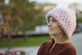 Beautiful woman and knitted jacket. Portrait of the happy woman