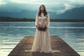 Beautiful woman on lake pier Royalty Free Stock Photo