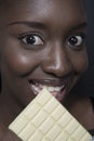 Beautiful woman with a large bar of choccolate Royalty Free Stock Photo