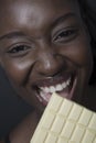 Beautiful woman with a large bar of choccolate Royalty Free Stock Photo