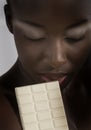 Beautiful woman with a large bar of choccolate Royalty Free Stock Photo