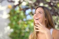 Beautiful woman laughing and looking above