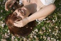 Beautiful Woman Laughing While Lying On Grass Royalty Free Stock Photo