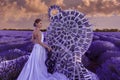 Beautiful woman in lavender field with treble clef and piano throne Royalty Free Stock Photo