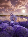 Beautiful woman in lavender field with treble clef and piano throne Royalty Free Stock Photo