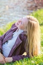 Beautiful Woman Laying on River Bank Royalty Free Stock Photo