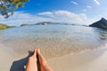 Beautiful woman legs, Beach Playa de Formentor in Mallorca, Balearic Islands, Spain Royalty Free Stock Photo