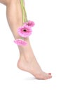 Beautiful woman legs and feet with flowers