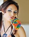 Beautiful woman licking lollipop Royalty Free Stock Photo