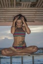 Beautiful woman in lifeguard tower on the beach Royalty Free Stock Photo