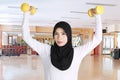 Beautiful woman lifting two dumbbells Royalty Free Stock Photo