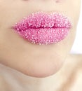 Beautiful woman lips with sugar close-up tasty